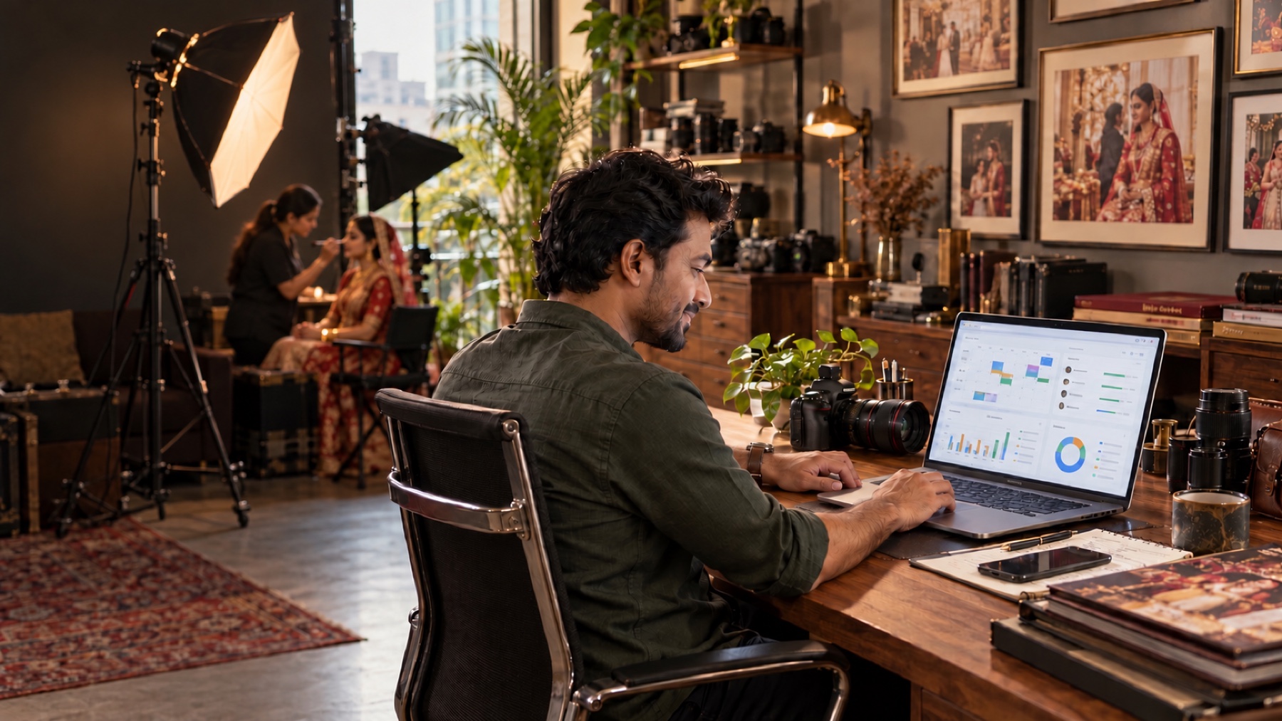 Bangladeshi wedding business owner managing bookings and accounts on a laptop